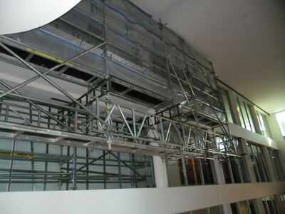 cantilever out from walkway to access ceiling in very highset atrium area