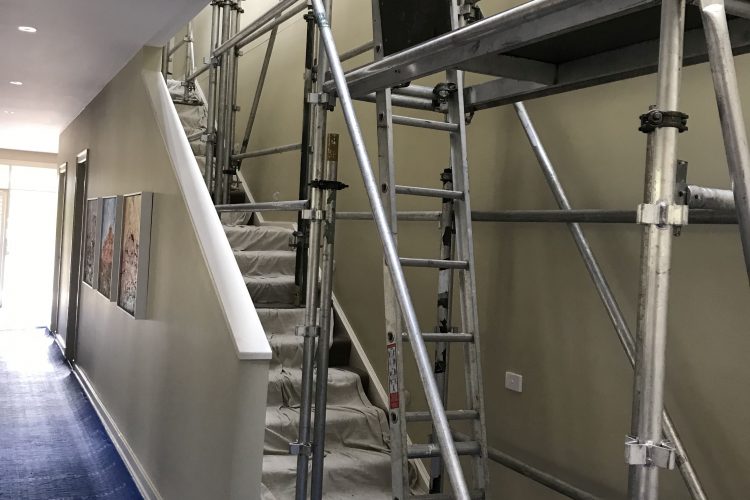 Scaffolding a stairwell for ceiling maintenance